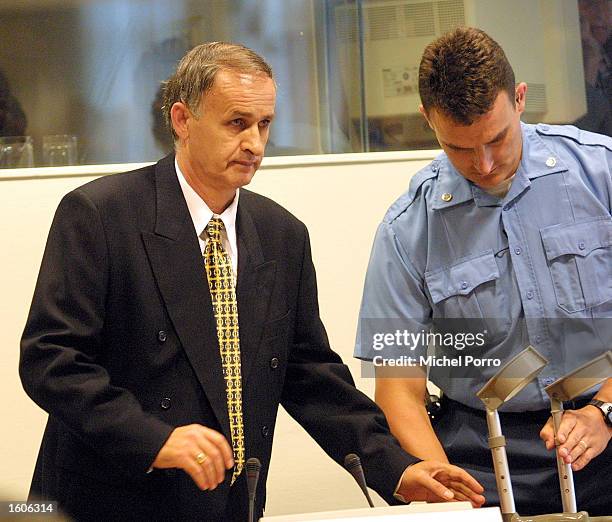 Bosnian Serb General Radislav Krstic, convicted of genocide for the 1995 massacre of thousands of Muslim men in Srebrenica, enters court August 2,...