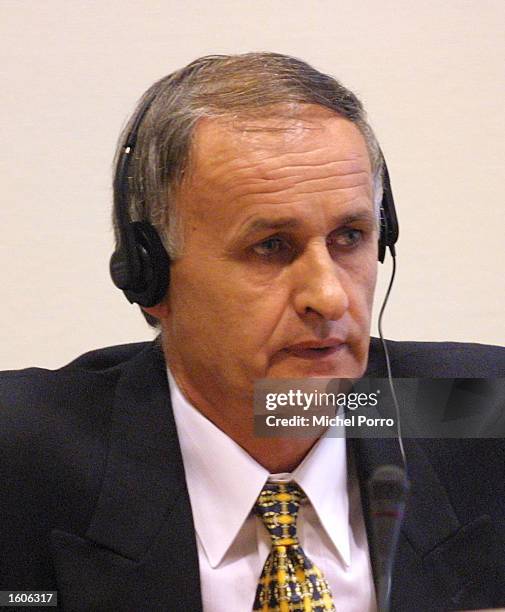 Bosnian Serb General Radislav Krstic, convicted of genocide for the 1995 massacre of thousands of Muslim men in Srebrenica, sits in court August 2,...