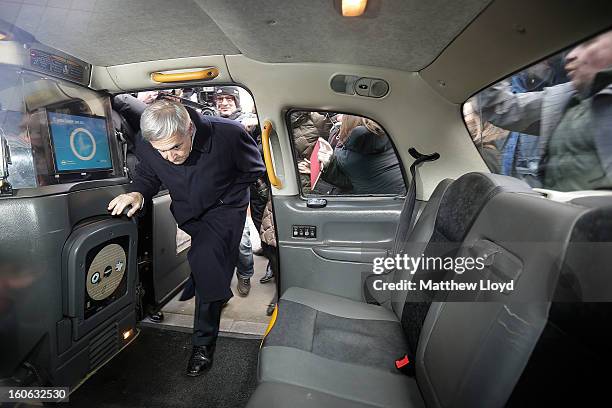 Former Cabinet Minister Chris Huhne leaves Southwark Crown Court in a taxi with Carina Trimingham on February 4, 2013 in London, England. Huhne and...