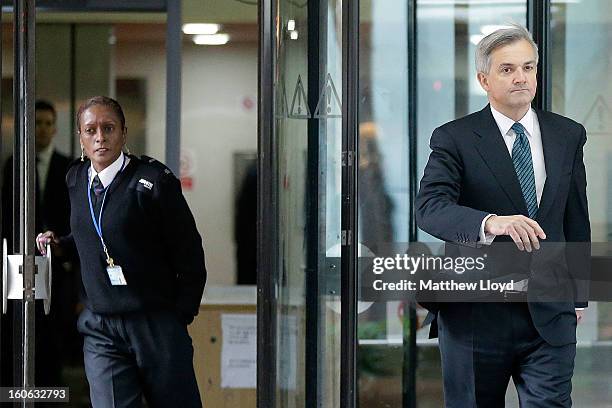 Former Cabinet Minister Chris Huhne leaves Southwark Crown Court to make a statement to the press on February 4, 2013 in London, England. Huhne and...