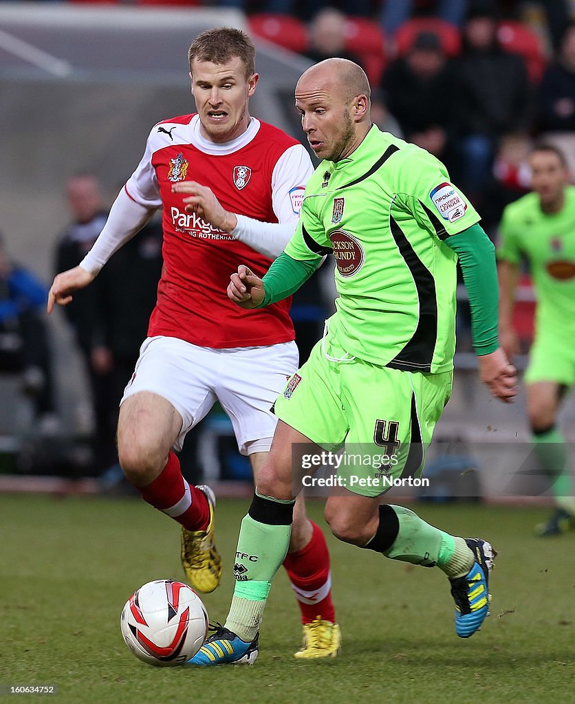Luke Rotherham Luke Guttridge of Northampton Town moves forward with the ball... News ...