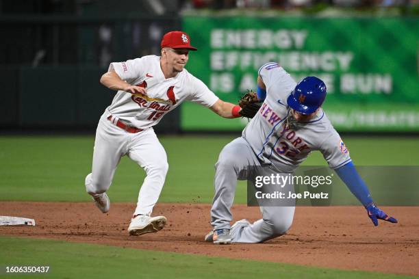 Daniel Vogelbach of the New York Mets is tagged out by Tommy Edman of the St. Louis Cardinals in the eighth inning at Busch Stadium on August 17,...