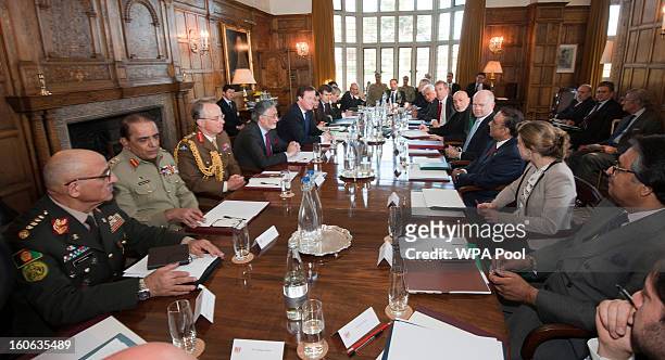 Britain's Prime Minister David Cameron , Foreign Secretary William Hague , Afghan President Hamid Karzai and Pakistani President Asif Ali Zardari...