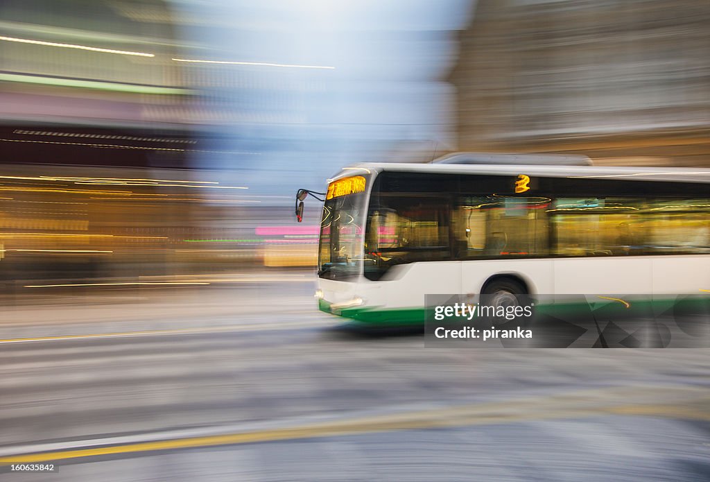 Bus driving on city street