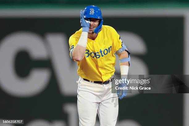 Trevor Story of the Boston Red Sox reacts after hitting a double during the fourth inning against the Kansas City Royals at Fenway Park on August 10,...