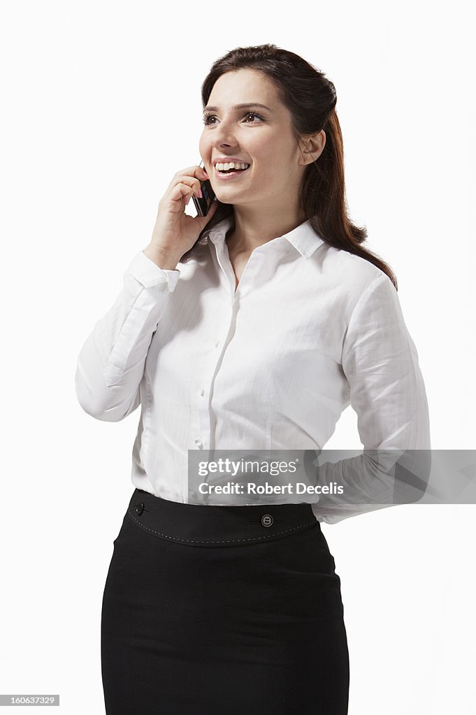 Relaxed business woman chatting on smart phone
