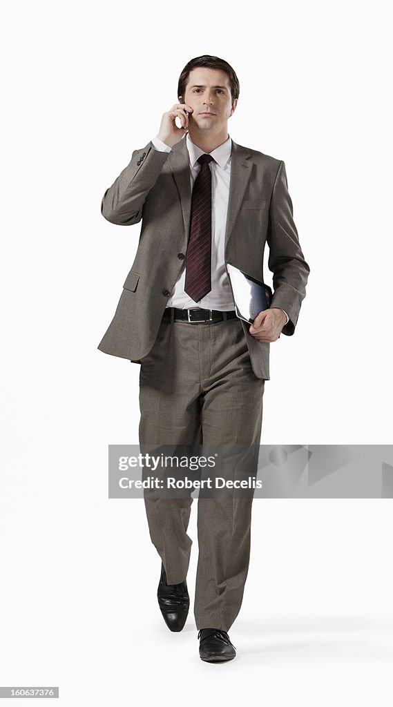 Business man on smart phone with tablet