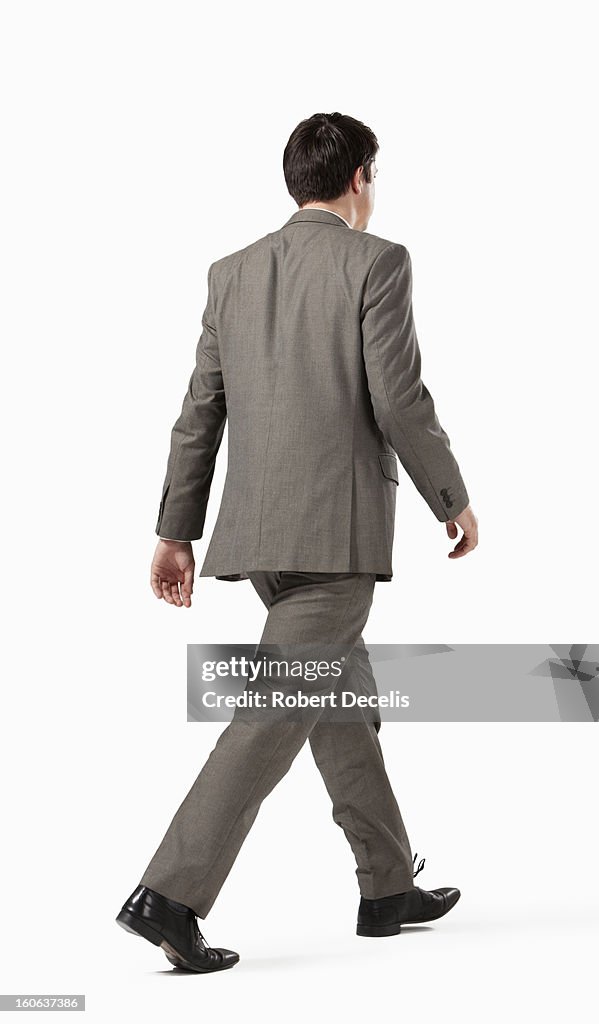 Business man walking away from camera