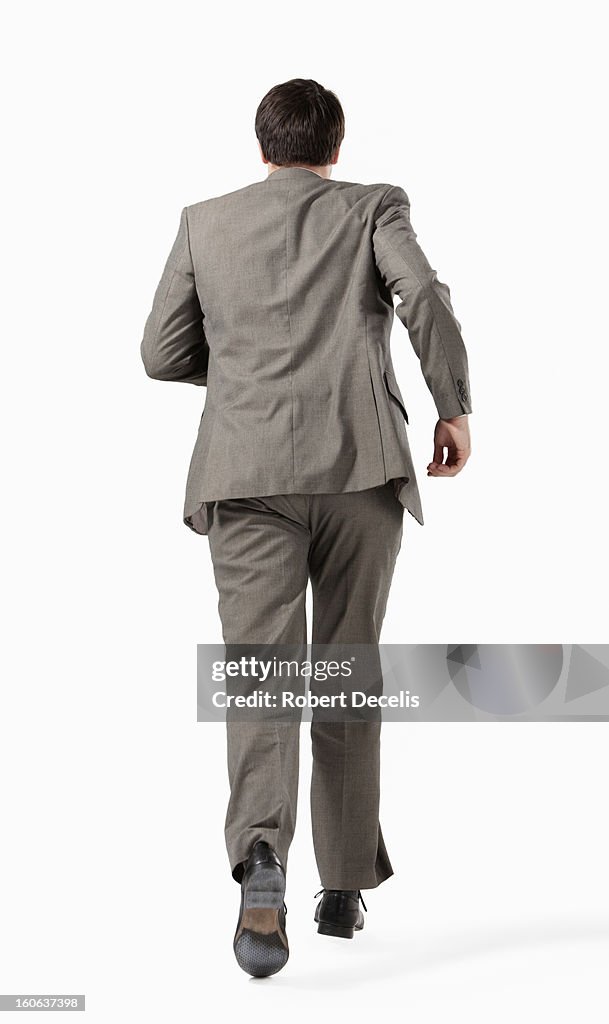 Business man running away from camera