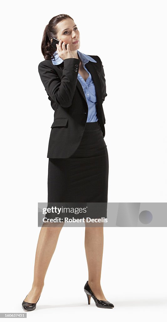 Business woman using smart phone standing