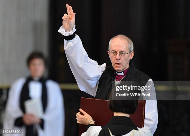 The Rt Revd Justin Welby gives a blessing at the close of the ceremony to confirm his election as Archbishop of Canterbury at St Paul's Cathedral on...