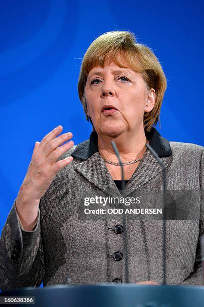 German Chancellor Angela Merkel addresses a press conference with Spain's prime minister at the Chancellery in Berlin on February 4, 2013 after their...