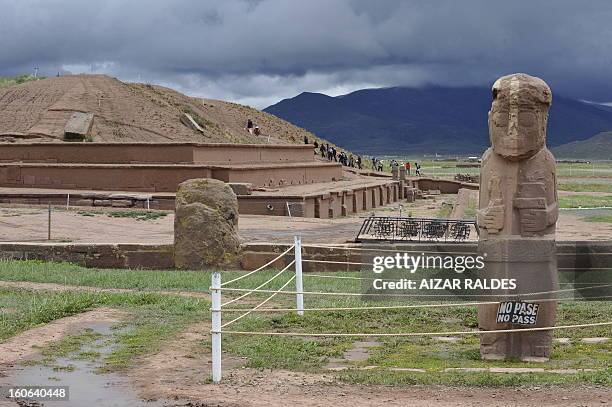 Tourists walk in the Akapana ruins in the archaeological site of Tiwanaku, 71 km west of La Paz on January 14, 2010. Bolivian President Evo Morales...