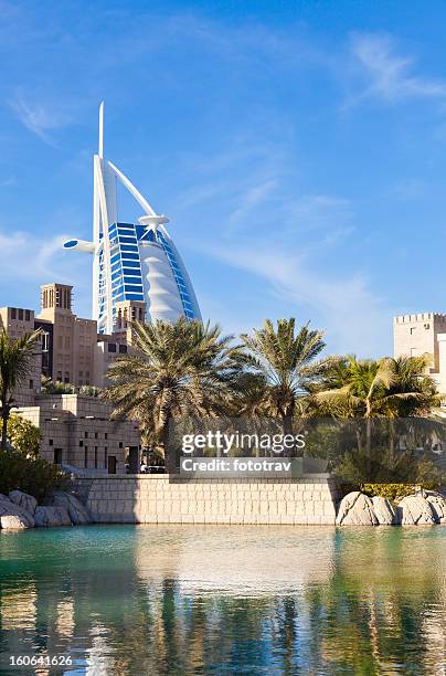 madinat jumeira and burj al arab in background, dubai - madinat jumeirah hotel stock pictures, royalty-free photos & images