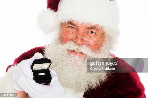 santa claus - man holding engagement ring stock pictures, royalty-free photos & images