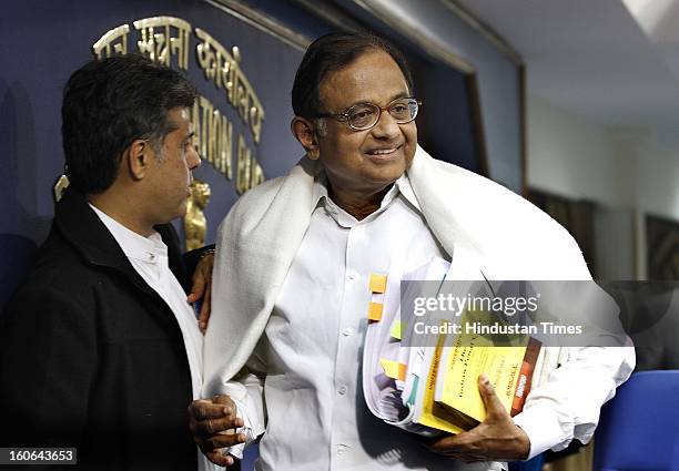 Union Finance Minister P. Chidambaram with Manish Tewari Union minister of State for Information and Broadcasting at press Conference on February 4,...