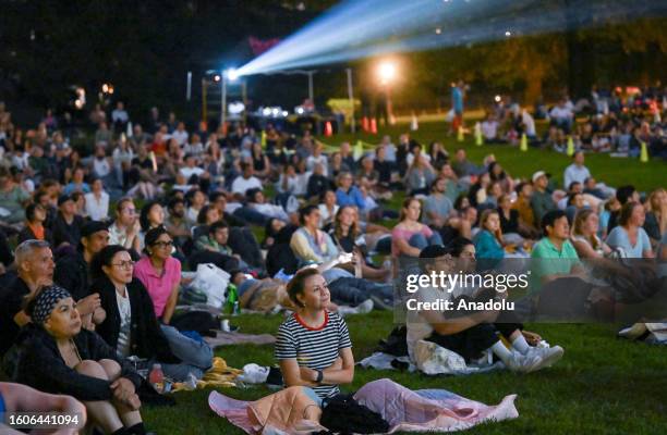 People gather to watch outdoor screening of 'Wild Life' during Central Park Film Festival in New York, United States on August 17, 2023. Every year,...