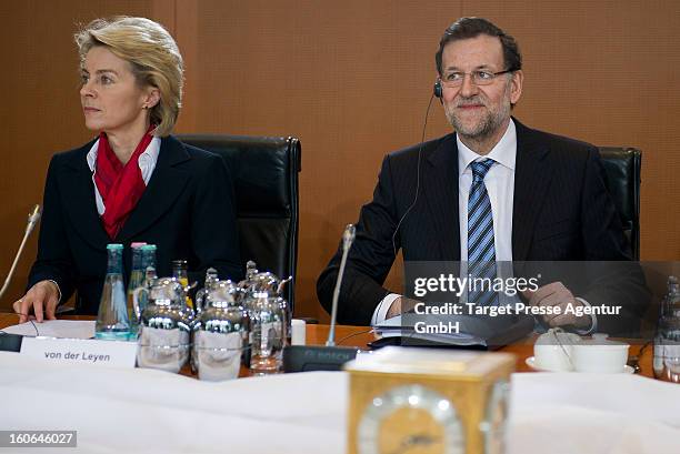 German Social Minister Ursula von der Leyen sits next to Spanish Prime Minister Mariano Rajoy at the Chancellery on February 4, 2013 in Berlin,...