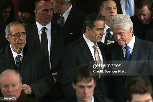 Former President Bill Clinton and New York Gov. Andrew Cuomo exit funeral services for former New York Mayor Ed Koch at Manhattan's Temple Emanu-El...