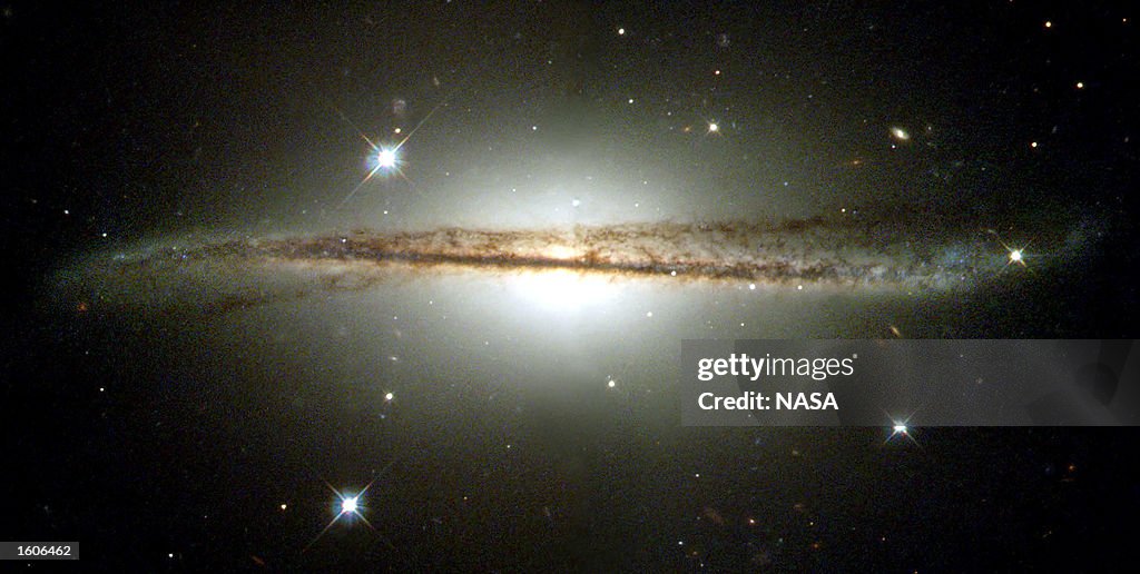 Hubble Images Of Warped Disk Galaxy