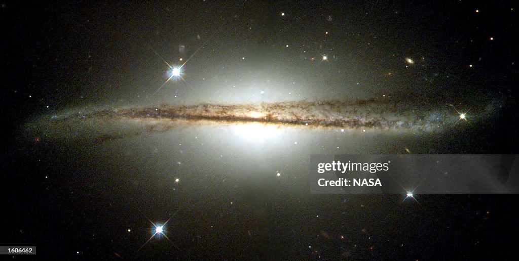 Hubble Images Of Warped Disk Galaxy