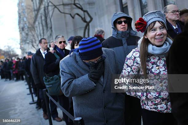 Members of the public wait in the cold to enter funeral services for former New York City Mayor Ed Koch at Manhattan's Temple Emanu-El on February 4,...