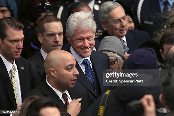 Large crowd gathers around former U.S. President Bill Clinton following the funeral services for former New York Mayor Ed Koch at Manhattan's Temple...