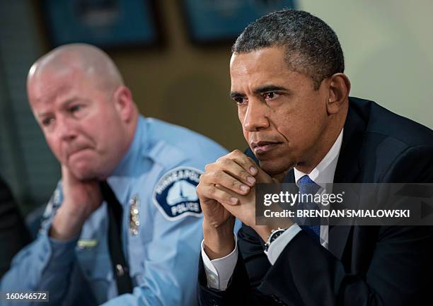 Minneapolis Public Schools School Resource Officer Mike Kirchen and US President Barack Obama listen during a round table discussion at the...