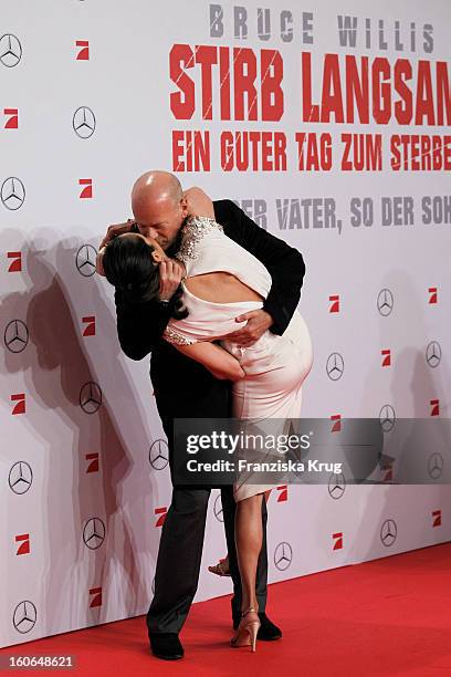 Bruce Willis and Emma Heming attend the German premiere of 'Die Hard - Ein Guter Tag Zum Sterben' at the cinestar Potsdamer Platz on February 4, 2013...