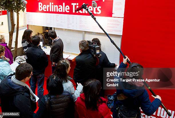 Enthusiasts that buy the first Festival Tickets for the 63rd Berlinale International Film Festival are accompanied by the media on February 4, 2013...