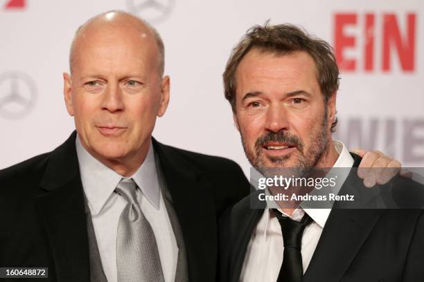 Bruce Willis and Sebastian Koch attend 'Die Hard - Ein Guter Tag Zum Sterben' Germany Premiere at Cinestar Potsdamer Platz on February 4, 2013 in...