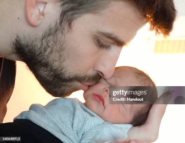 In this handout provided by UNICEF, Gerard Pique and Shakira introduce their son, Milan Pique Mebarak on February 4, 2013. Milan was born on January...