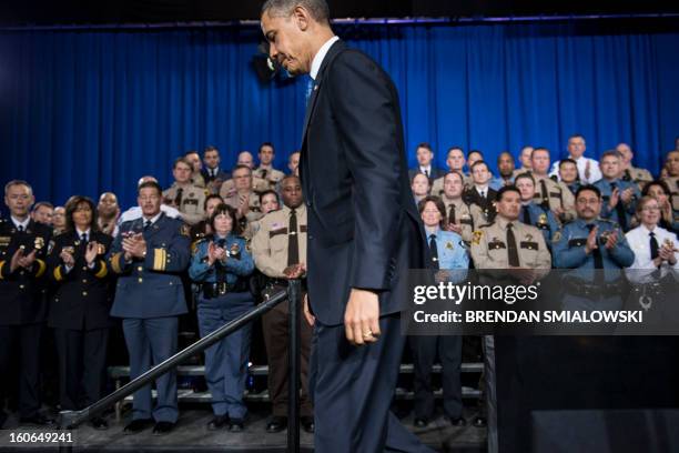 President Barack Obama leaves after speaking about gun violence at the Minneapolis Police Department's special operations center on February 4, 2013...