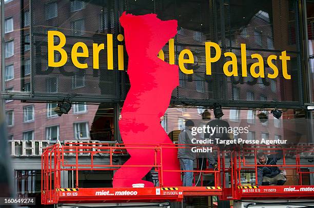Workers assemble a signboard at the Berlinale Palast for the 63rd Berlinale International Film Festival on February 4, 2013 in Berlin, Germany. The...