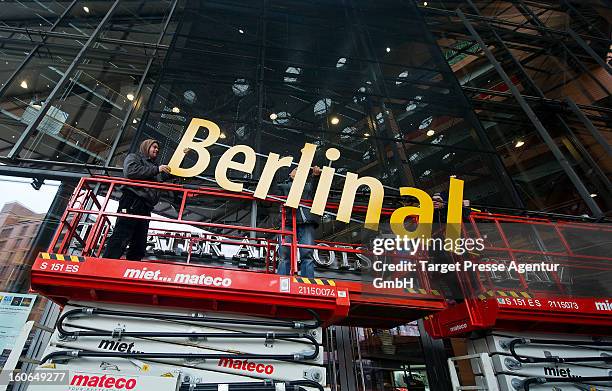 Workers assemble a signboard at the Berlinale Palast for the 63rd Berlinale International Film Festival on February 4, 2013 in Berlin, Germany. The...