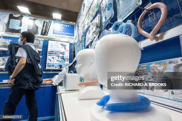 This photo taken on July 27, 2023 shows neck coolers displayed by Global Japan, during the "Tokyo Extreme Heat Countermeasures Exhibition" during...