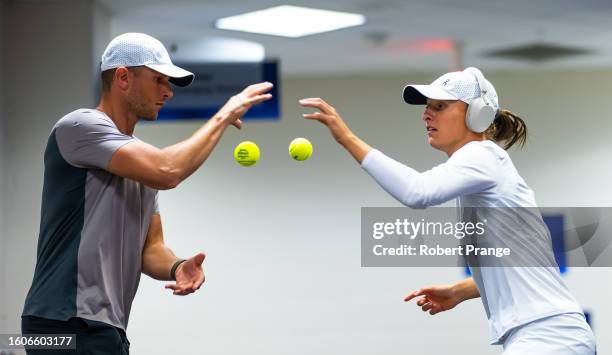 Iga Swiatek of Poland warms up before playing against Qinwen Zheng of China in the third round on Day 5 of the Western & Southern Open at Lindner...