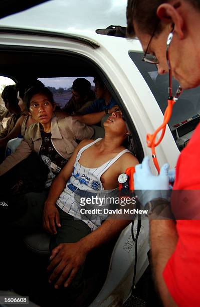 Border Patrol BORSTAR agent David Howard treats an illegal immigrant, July 29, 2001 on the Tohono O''odham Indian Reservation, west of Tucson, AZ....