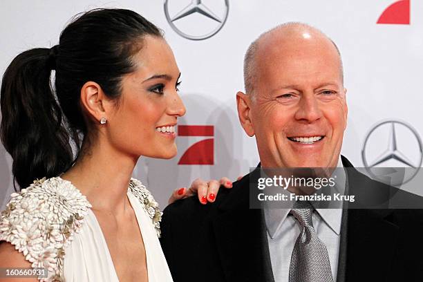 Bruce Willis and Emma Heming attend the German premiere of 'Die Hard - Ein Guter Tag Zum Sterben' at the cinestar Potsdamer Platz on February 4, 2013...