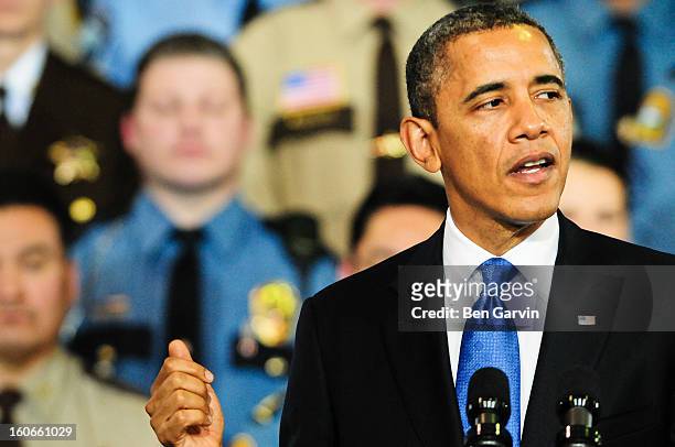 President Barack Obama speaks before a crowd of local leaders and law enforcement officials at the Minneapolis Police Department Special Operations...
