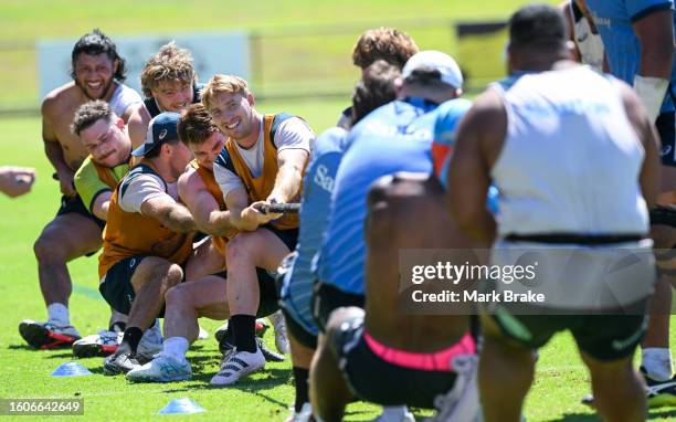 Wallabies finish of training with a tug-of-war during the Australia Wallabies training session at the Territory Rugby Stadium on August 11, 2023 in...