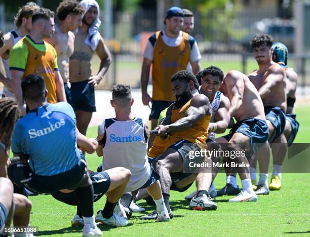 Wallabies finish of training with a tug-of-war during the Australia Wallabies training session at the Territory Rugby Stadium on August 11, 2023 in...