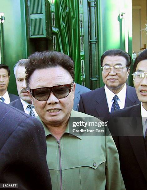 North Korean leader Kim Jong Il, center, arrives August 1, 2001 at the train station in the Siberian city of Omsk, Russia for the first stopover on...