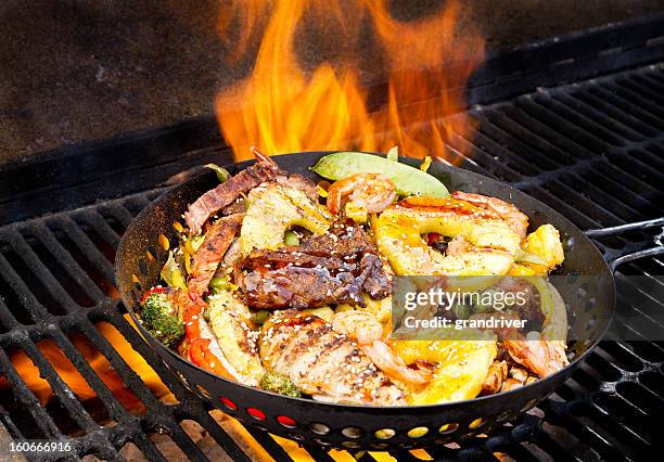 stir fry on barbecue grill - burnt chicken stock pictures, royalty-free photos & images