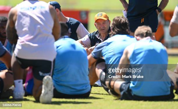 Eddie Jones head coach of the Wallabies chats to players during the Australia Wallabies training session at the Territory Rugby Stadium on August 11,...