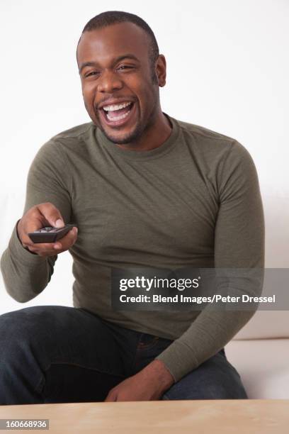 Man Using Remote Control 545 Black Man Remote Control Stock Photos, High-Res Pictures, and ...