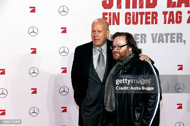 Actor Bruce Willis and director John Moore attend the 'Die Hard - Ein Guter Tag Zum Sterben' Germany premiere at CineStar Sony Center on February 4,...