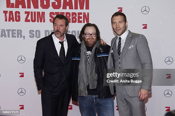 German actor Sebastian Koch, director John Moore and actor Jai Courtney attend the 'Die Hard - Ein Guter Tag Zum Sterben' Germany premiere at...