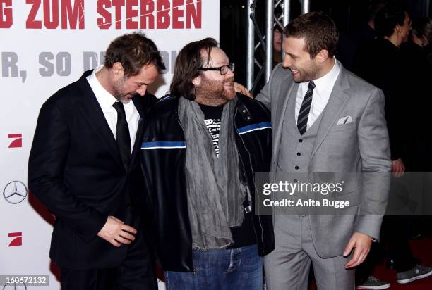 German actor Sebastian Koch, director John Moore and actor Jai Courtney attend the 'Die Hard - Ein Guter Tag Zum Sterben' Germany premiere at...