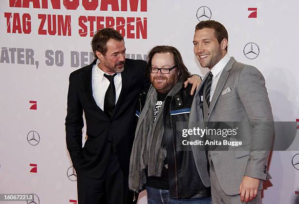 German actor Sebastian Koch, director John Moore and actor Jai Courtney attend the 'Die Hard - Ein Guter Tag Zum Sterben' Germany premiere at...